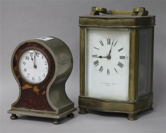 A brass carriage clock and a faux tortoiseshell timepiece